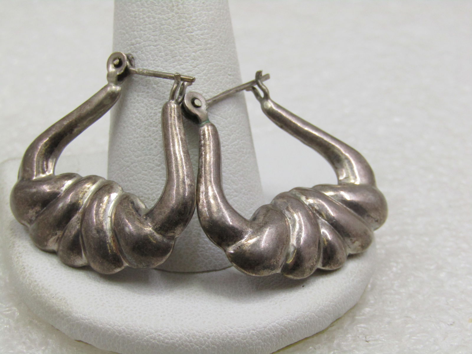 Vintage Sterling Puffy Hoop Earring with Ridged Design, 1960's-1970's, Boho: Vintage Sterling Puffy Hoop Earring with Ridged Design, 1960's-1970's. 1" tall and 1.25" wide with hinged locking post. They are marked .925 and tested and test as sterling. Weight is appx. 6.75