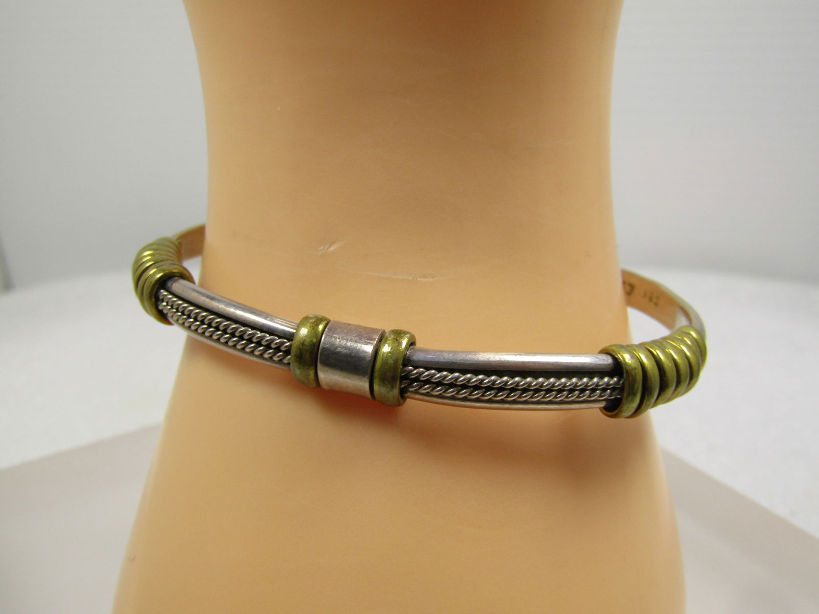 Vintage Sterling & Brass Cuff Bracelet, 6.75", 1980's, Unisex: Vintage Sterling & Brass Cuff Bracelet, 6.75", 1980's. Unisex..This is appx. 5mm wide and slightly domed with a double twist band down the center held with the wrapped brass accents - the twists are a