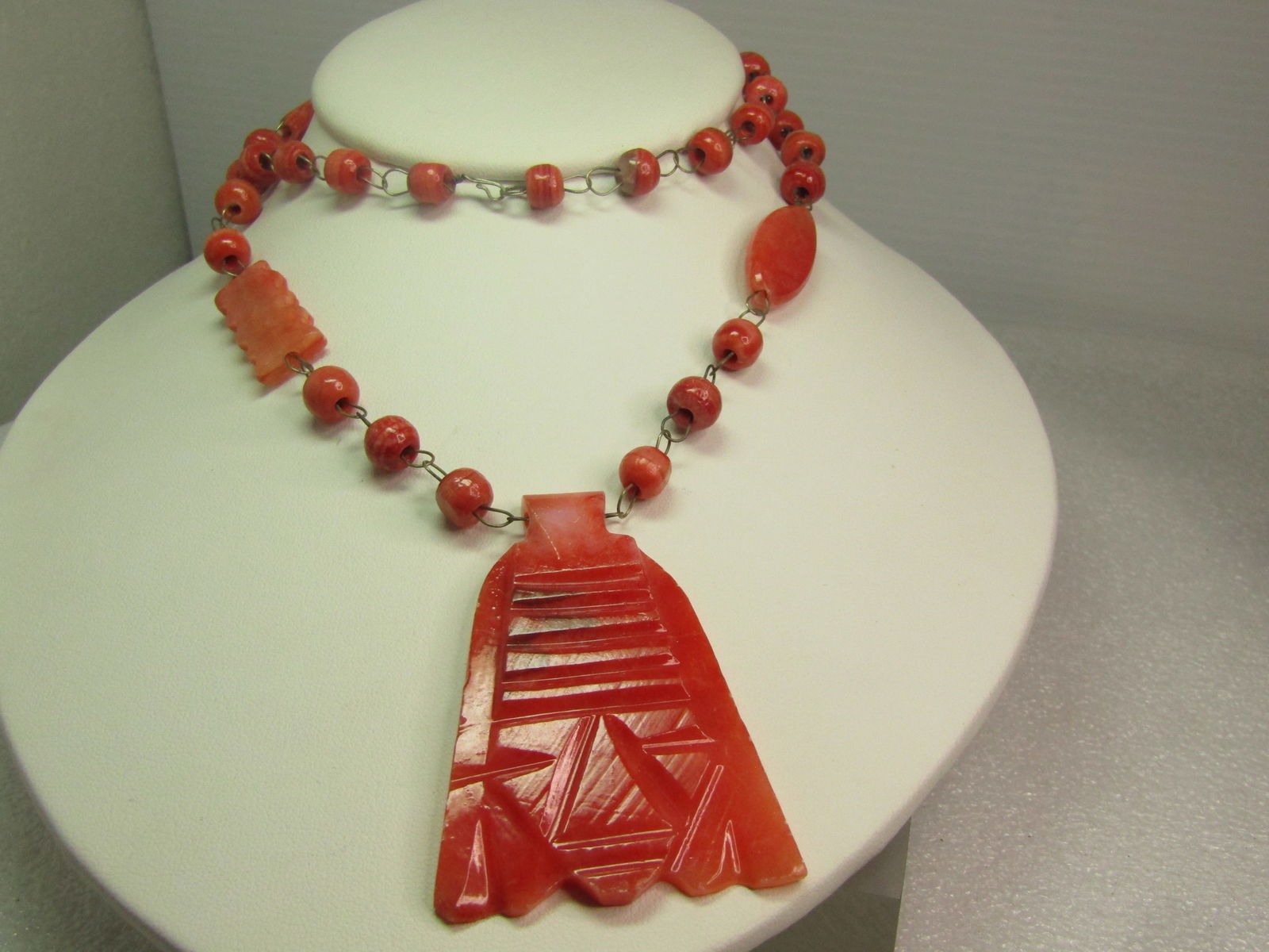 Vintage Carved Orange Quartz Tribal Necklace, 24", 1970's: Vintage Carved Orange Quartz Tribal Necklace, 24", 1970's. This is believed dyed quartz with a craved cultural face, more Incan, Peruvian tribal look with 8mm round beads that are irregular in shapean