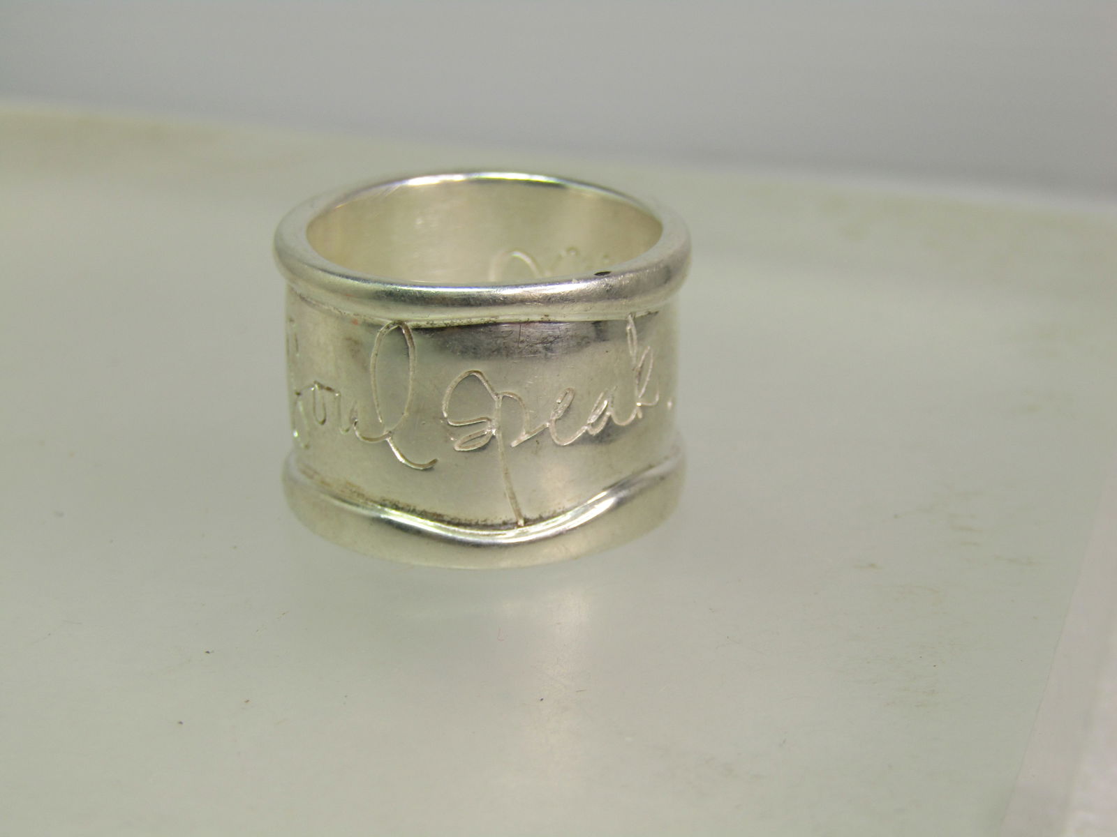 Sterling Hear My Soul Speak Wide Ring, Shawn Killinger, Sz. 8, 1990's, Statement/Motivational: Sterling Hear My Soul Speak Wide Ring, Shawn Killinger, Sz. 8. This is appx. 15mm wide with raised edges and in large scripted writing "hear my soul speak" ring. Signed Shane inside the ring with anot