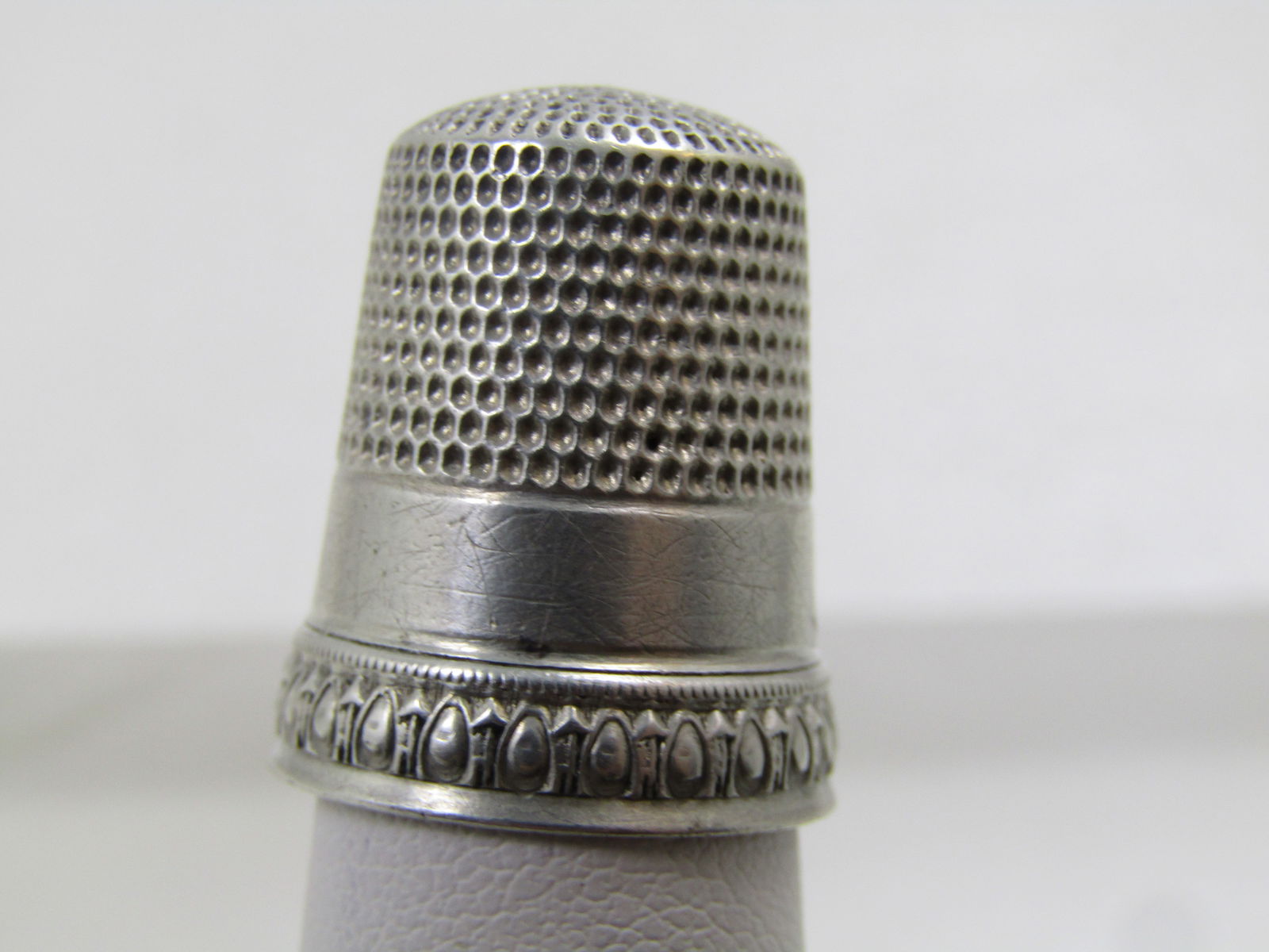 Victorian Sterling Thimble, Sz. 11, Marked Priscilla & Signed S: Victorian Sterling Thimble, Sz. 11, Marked Priscilla & Signed S for Simon Brothers, dated with patent of May 31, 1898. Victorian. This is marked sterling and tests as sterling with a weight of appx. 4