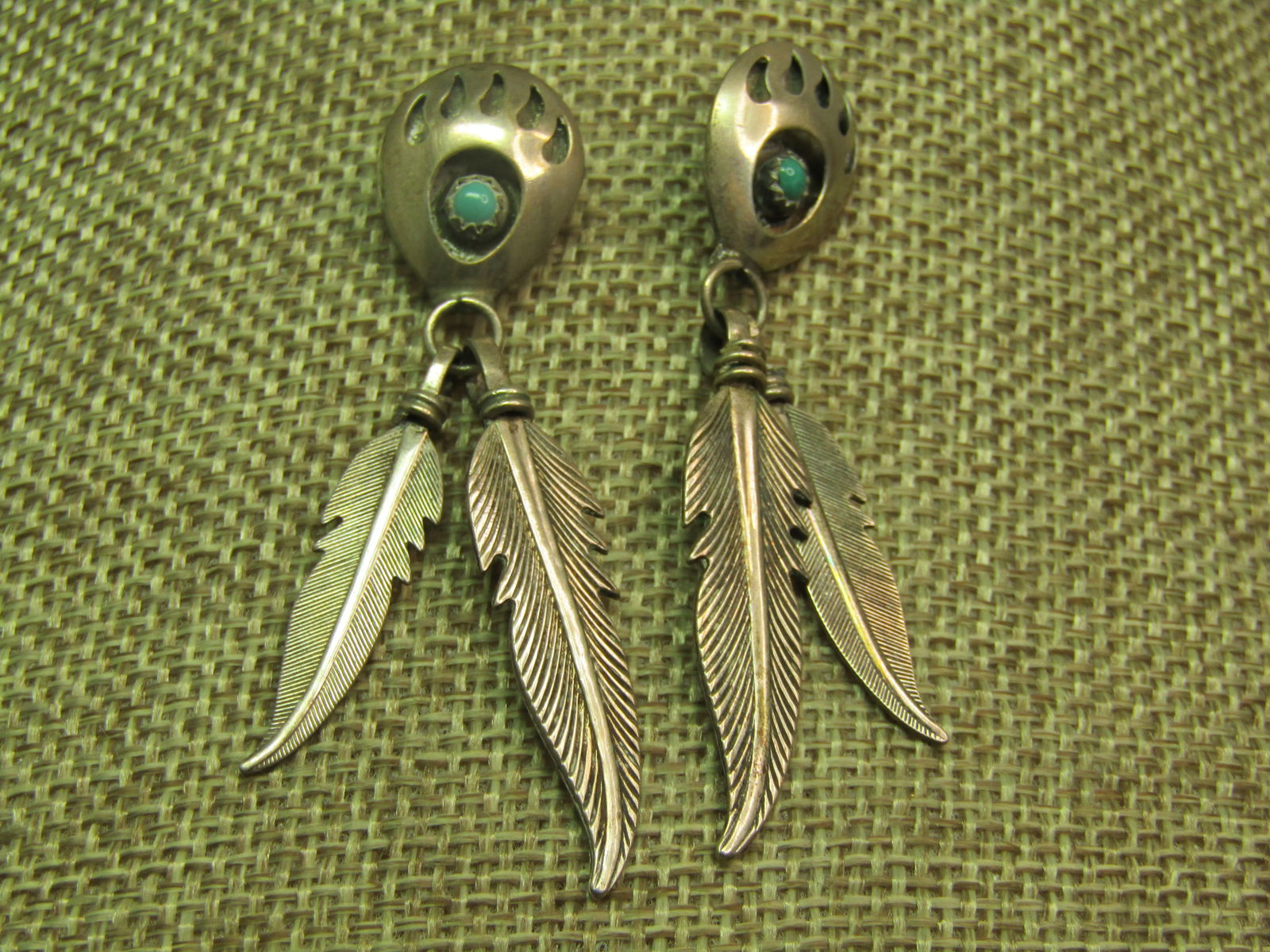 Vintage Sterling Southwestern Turquoise Bear Paw Earrings, Drop Feathers, On Card, 1970's-1980's: Vintage Sterling Southwestern Turquoise Bear Paw Earrings, Drop Feathers, On Card, 1970's-1980's. The stud is a shadow box style bear paw with cut-out claws and a snakeeye turquoise stone set in the o