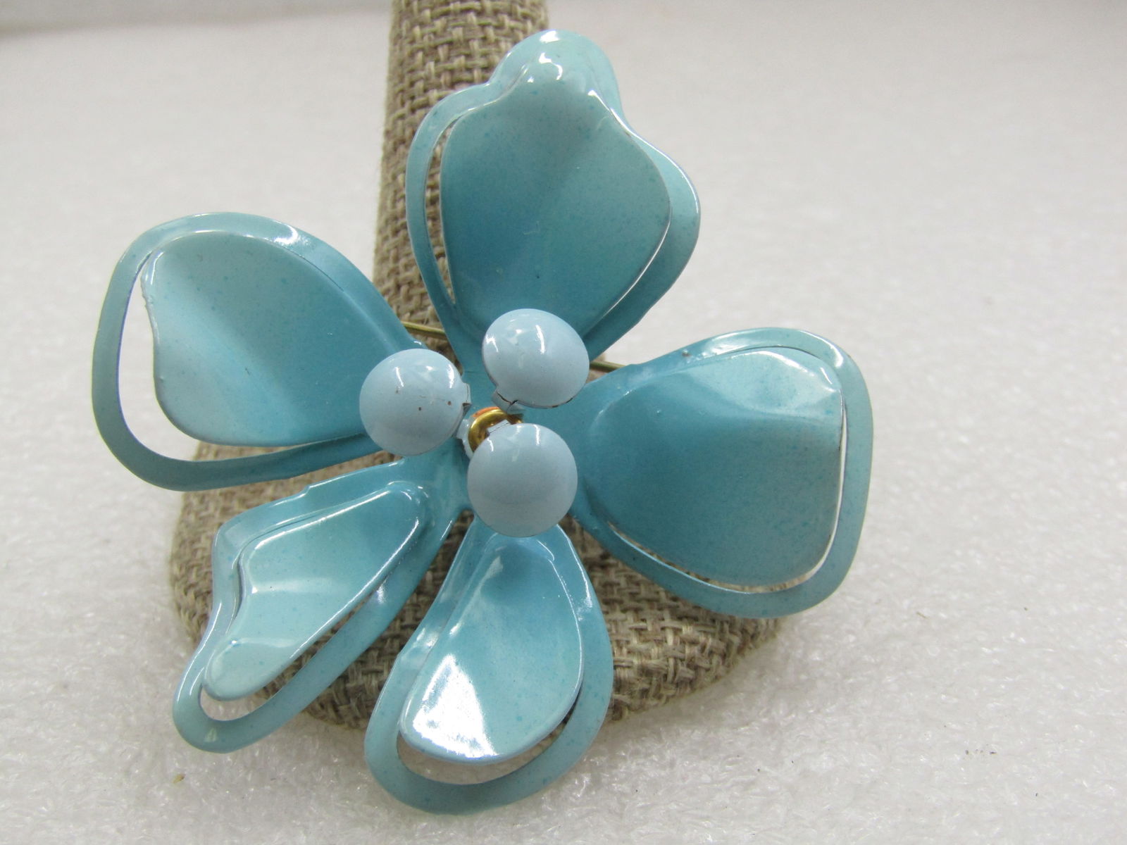 Vintage Enameled Aqua Floral Brooch, 1960's, 2.5": Vintage Enameled Aqua Floral Brooch, 1960's, 2.5". Five cut-out petals with curved upward petals and a frame that is somewhat curved down from the petal giving depth to the brooch as well as three ast