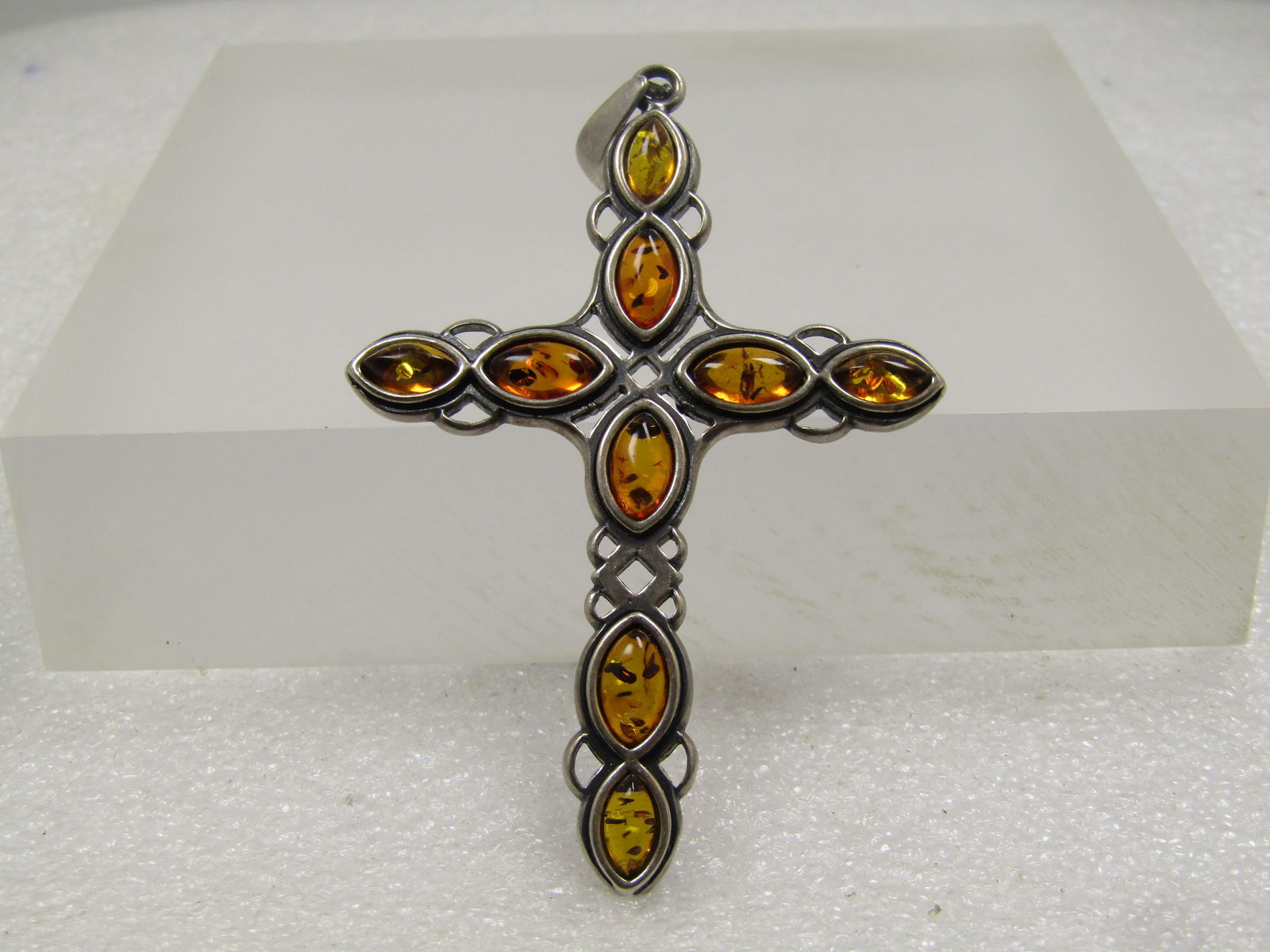 Vintage Sterling Amber Cross Pendant, Celtic Acccents, 3", 1980's-1990's: Vintage Sterling Amber Cross Pendant, Celtic Acccents, 3", 1980's-1990's. The cross is marked sterling and tests as sterling on the bail and cross with an appx. weight of 10.51 grams. It is beleived t