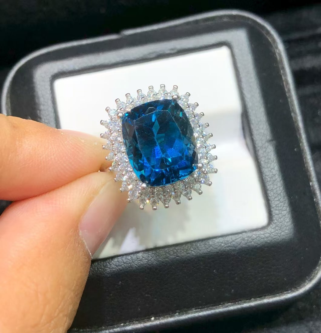 925 sterling silver natural topaz ring: Title: 925 sterling silver natural topaz ring Description: This ring showcases a captivating natural London blue topaz, meticulously set in sturdy S925 sterling silver. Its deep blue color is as