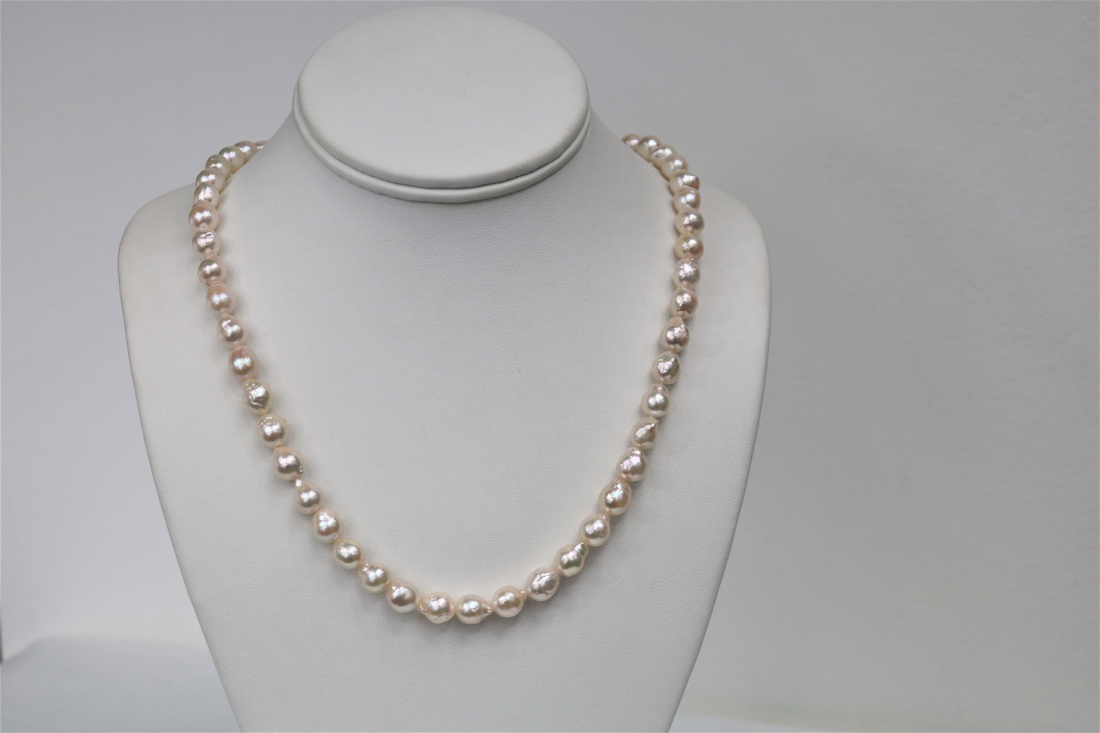 8.5-9mm Japanese Akoya Baroque Necklace with 14k Clasp: Title:8.5-9mm Japanese Akoya Baroque Necklace with 14k ClaspDescription:AAA Quality Necklace, White Rose in Color, Pearls from Japan, 43 pearl pieces 18 inches hand knotted with 14k YG fish-hook