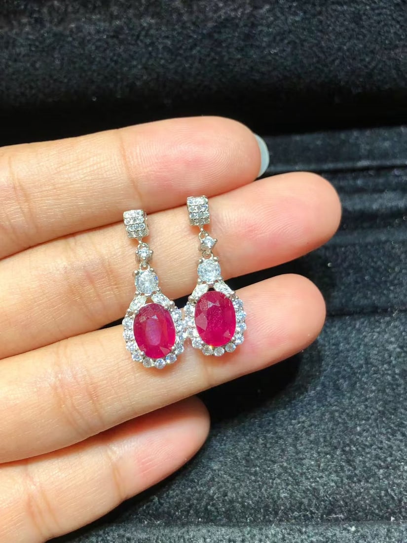 925 sterling silver natural ruby earrings: Title: 925 sterling silver natural ruby earrings Description: These earrings showcase the captivating charm of natural rubies, exquisitely set in heavy S925 sterling silver. The rich red color of the