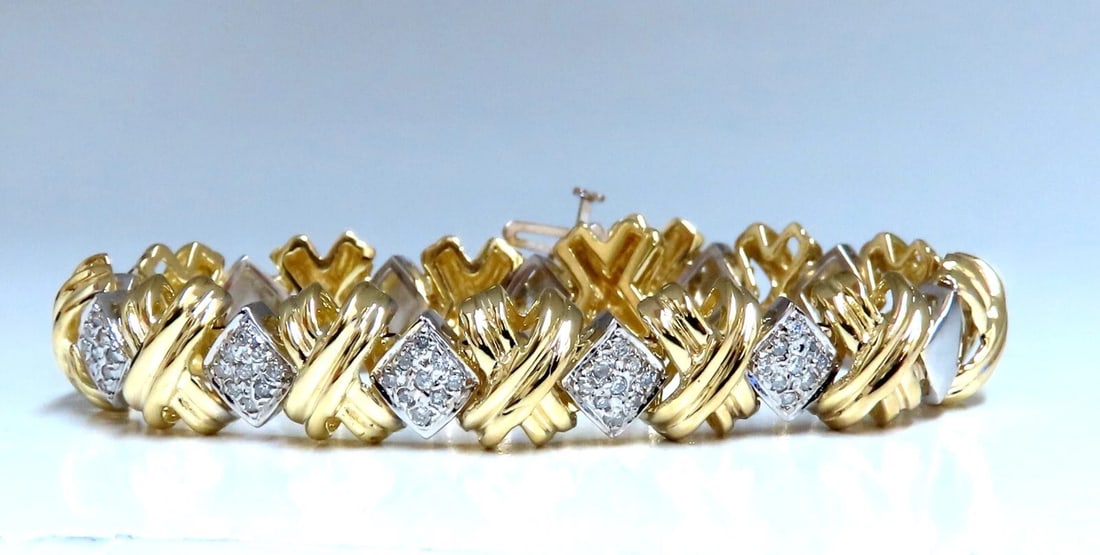 .86ct Natural Diamonds Bracelet 14kt Gold X link**: Title: .86ct Natural Diamonds Bracelet 14kt Gold X link** Description: Ladies natural Diamond classic X bracelet. .86ct Diamonds: H-I- color, vs-2 / si1 clarity. 14 karat yellow gold 27.3 grams Bracel