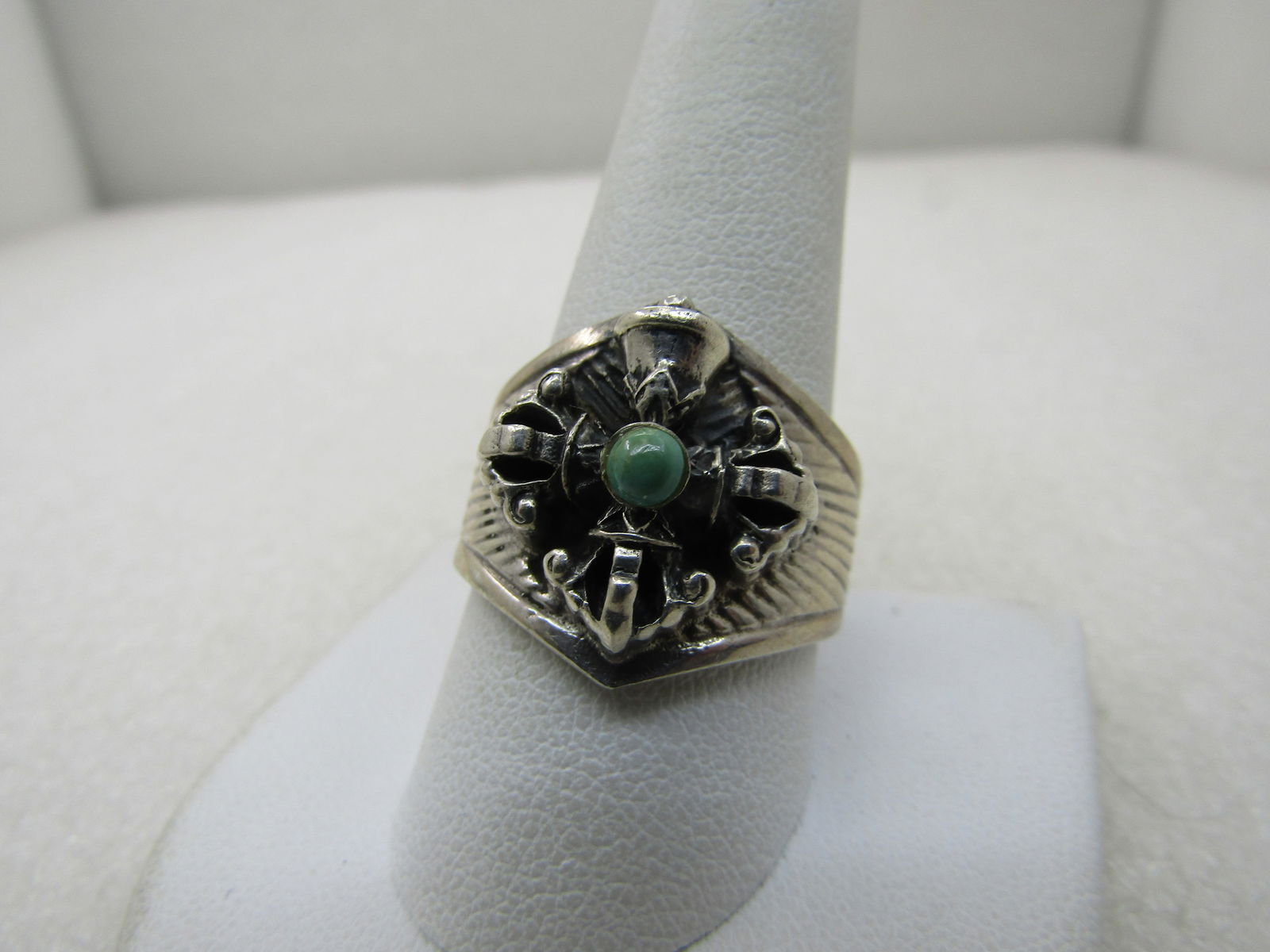 Vintage Sterling Bell Cross Turquoise Ring, Sz. 10.5, Unisex Cigar Band: Vintage Sterling Bell Cross Turquoise Ring, Snake Eye, Sz. 10.5, Unisex. There is a raised turquoise snake-eye, appx. 3mm, center to the ring that is bezel-set. Wide pointed cigar band style ring with