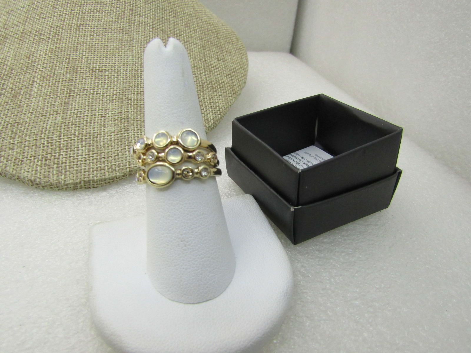 Avon Opalescent Stacking Ring Set Sz 6, In Original Box, New: Avon Opalescent Stacking Triple Ring Set Sz 6, In Original Box, New. Each ring has faux opal stones with rhinestiones and stack nicely together. 2019. From former seller's inventory. New condition,