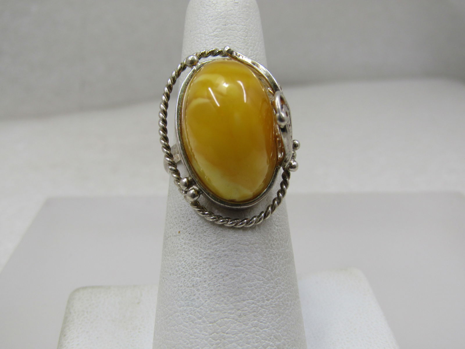 Sterling High Yellow Stone Ring, Filigree, Sz. 6.5: Sterling High Yellow Stone Ring, Filigree, Sz. 6.5. The stone is yellow with white and clearer yellow streaking through the ring. It sits high at appx. 12mm to the top of the stone from the top of