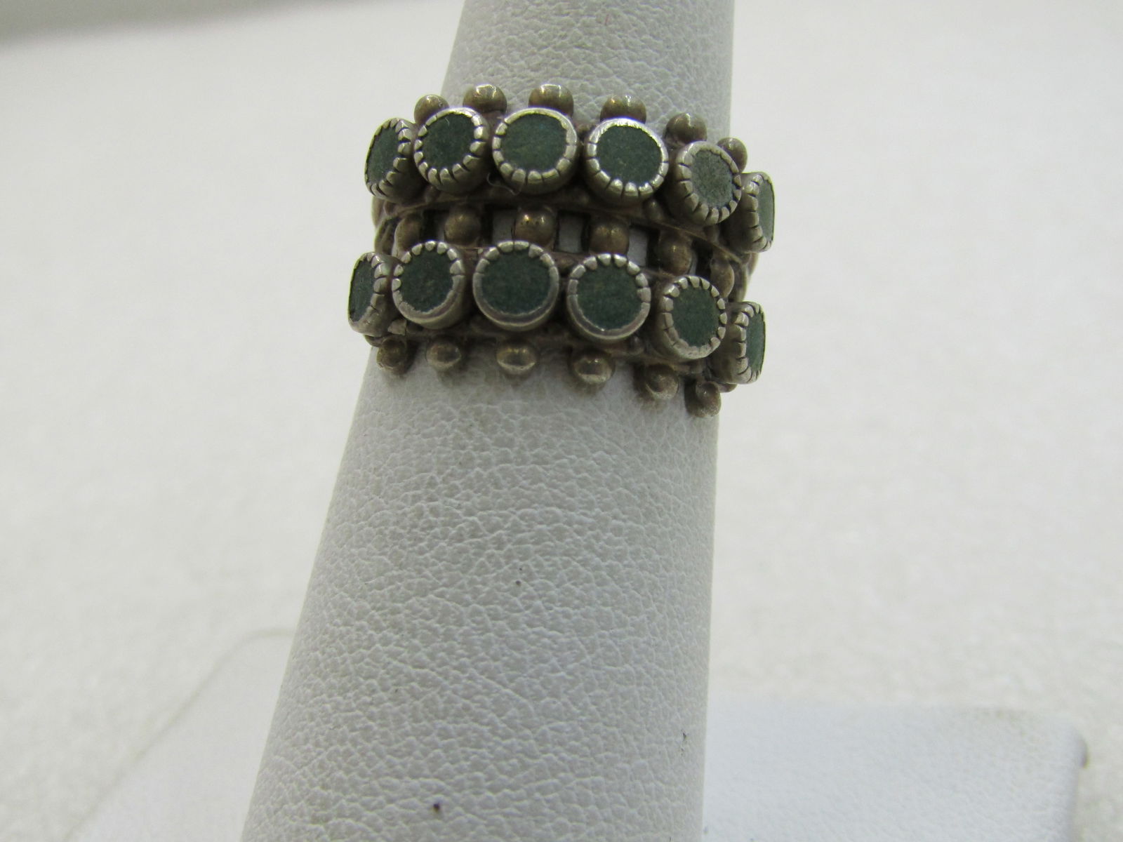Vintage Sterling Southwestern Turquoise Ring, Snake Eye, Sz. 6: Vintage Sterling Southwestern Turquoise Ring, Snake Eye, Sz. 6. Double Row with six appx. 3.5mm bezel-set stones in two rows with beaded accents. The ring crosses the entire top of the finger. It is a