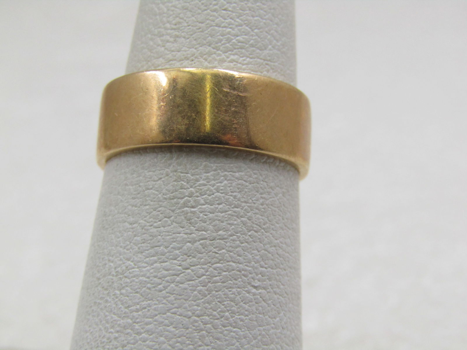 Vintage 14kt Wedding Band, 6.5mm, Sz. 5.5: Vintage 14kt Wedding Band, 6.5mm, Sz. 5.5, Signed and Marked. Marked 14kt and signed with a sideways M. Age is estimated at mid-century or slightly after. Heavy at 5.21 gr. Flat 1mm thick band that