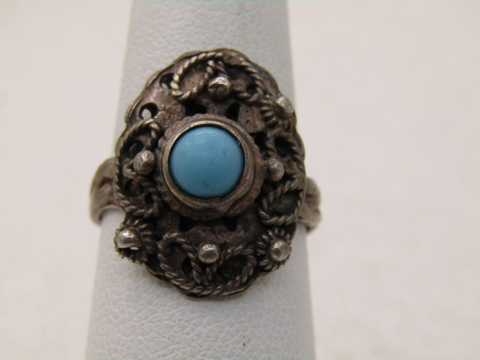 Vintage Southwestern Sterling Turquoise Ring, Sz. 7: Vintage Southwestern Sterling Turquoise Ring, Sz. 7, also has a Bali, Mid-East appeal. The sone is appx. 6.5mm, the ring weighs appx. 4.35 grams. The rop of the ring is appx. 18.8mm by 14.8mm and has