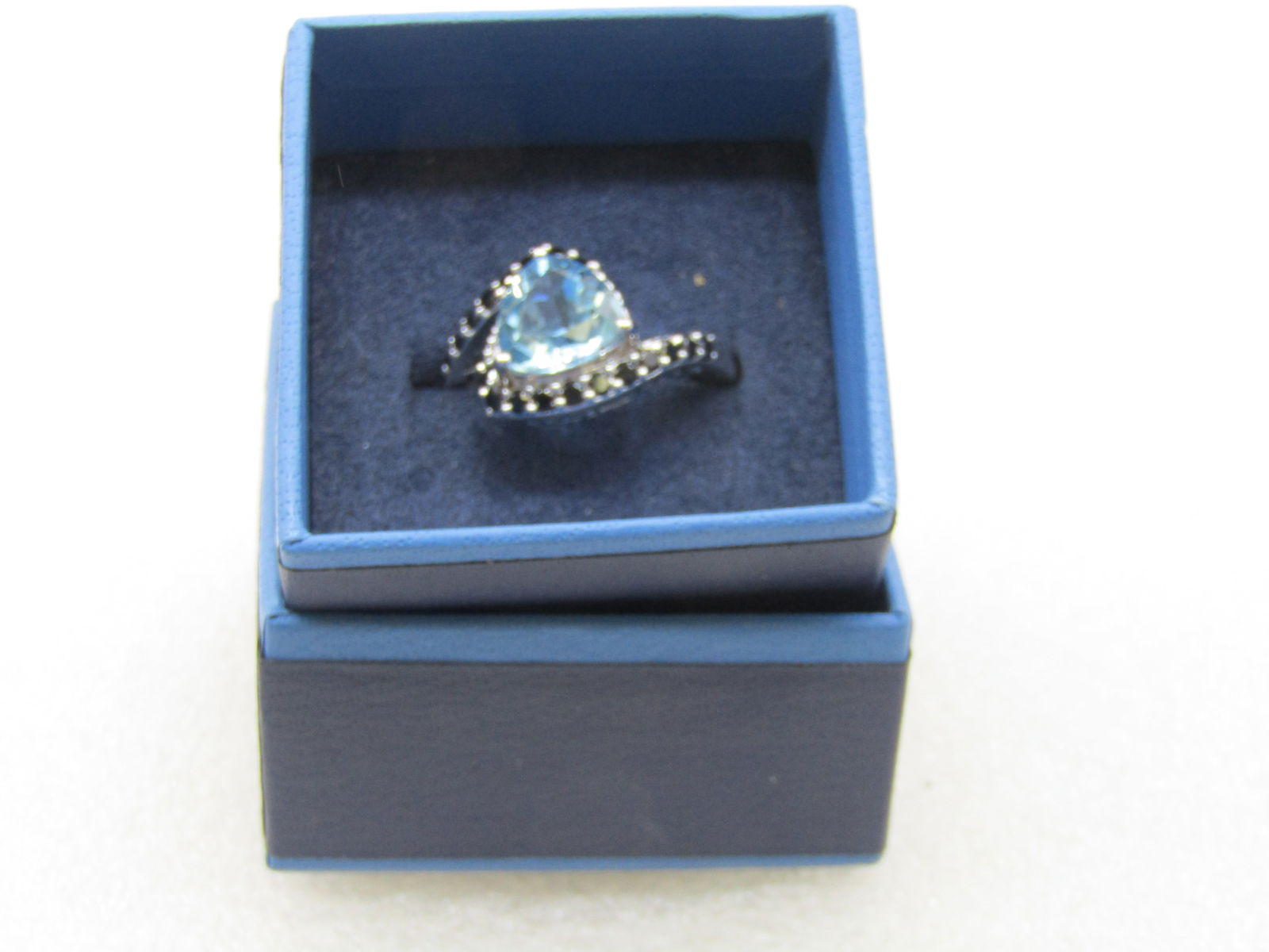 Sterling Silver Lab Topaz Triangular Ring, Sz. 10.5, Black Rhinestone Bypass: Sterling Silver Lab Topaz Triangular Ring, Sz. 10.5, Black Rhinestone Bypass. Triangular stone that is appx. 10mm down each side. The bands are bypass design coming off the upper side of the stone on