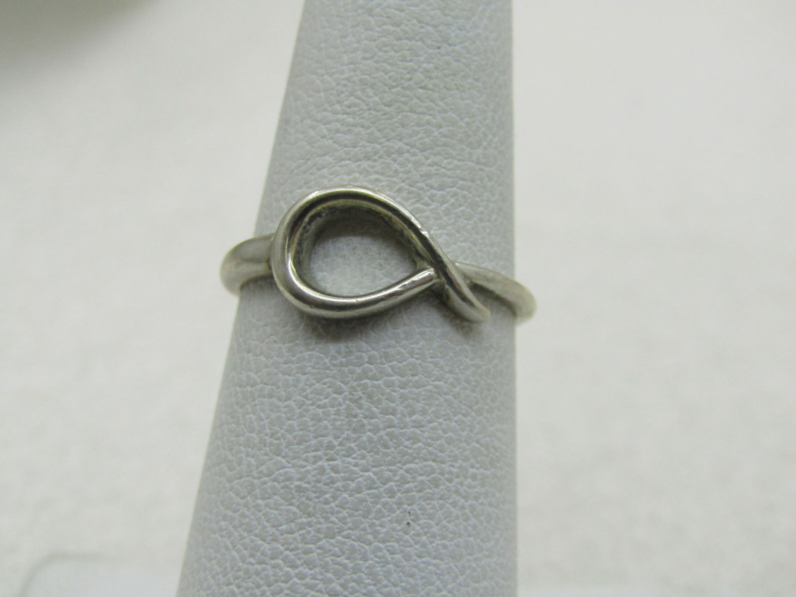Vintage Sterling Looped Ring, Sz. 6, Signed NVC (Nataliya Collister): Vintage Sterling Looped Ring, Sz. 6, Signed NVC, 6 and marked .925. Weight is appx. 1.56gr. The ring is appx. 7.5mm wide at the open loop with a little tail extending over the band. The band tapers