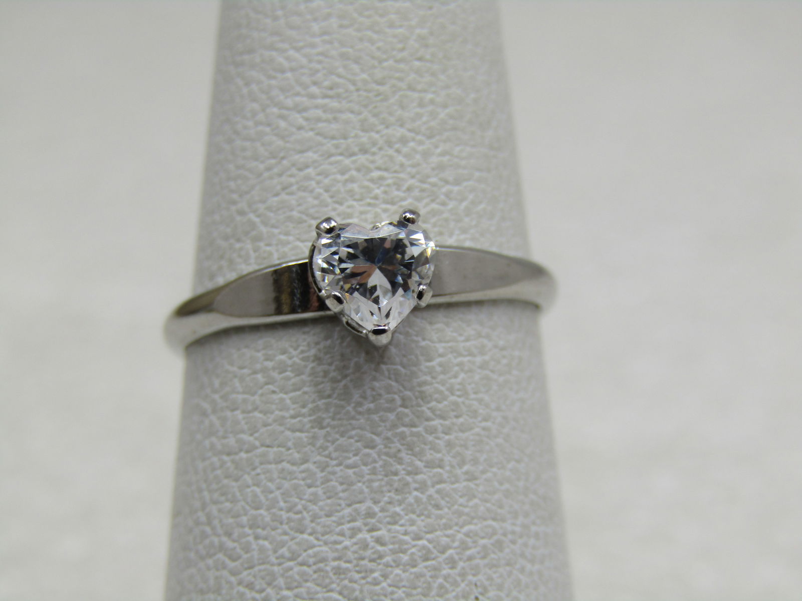 Sterling CZ Heart Ring, Sz. 6: Sterling CZ Heart Ring, Sz. 6. Promise ring or ring for someone special. It is marked ster and signed but the maker's mark is not complete to who know made this. The heart is appx. 5mm by 4.5mm and he