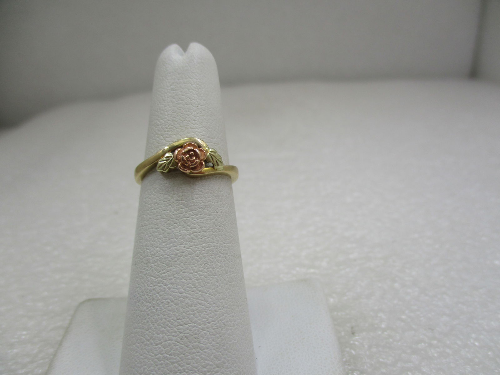 Vintage 10kt Black Hills Gold Rose Ring, Sz. 5.5, Landstroms: Vintage 10kt Black Hills Gold Rose Ring, Sz. 5.5, Landstroms. Marked 10kt and signed with Landstroms' mark. Weight is appx. 2.27 gr. The ring is two-tone yellow and rose gold with a rolse top center i