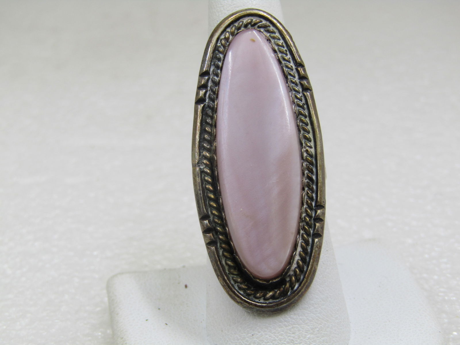 Vintage Sterling Southwestern Pink Faux Mother-of-Pearl Ring, Sz. 8: Vintage Sterling Southwestern Pink Faux Mother-of-Pearl Ring, Sz. 8. Unisex This is a long ring at 2" long and 3/4" wide. It has a triple split band where it connects to the upper part of the ring tha