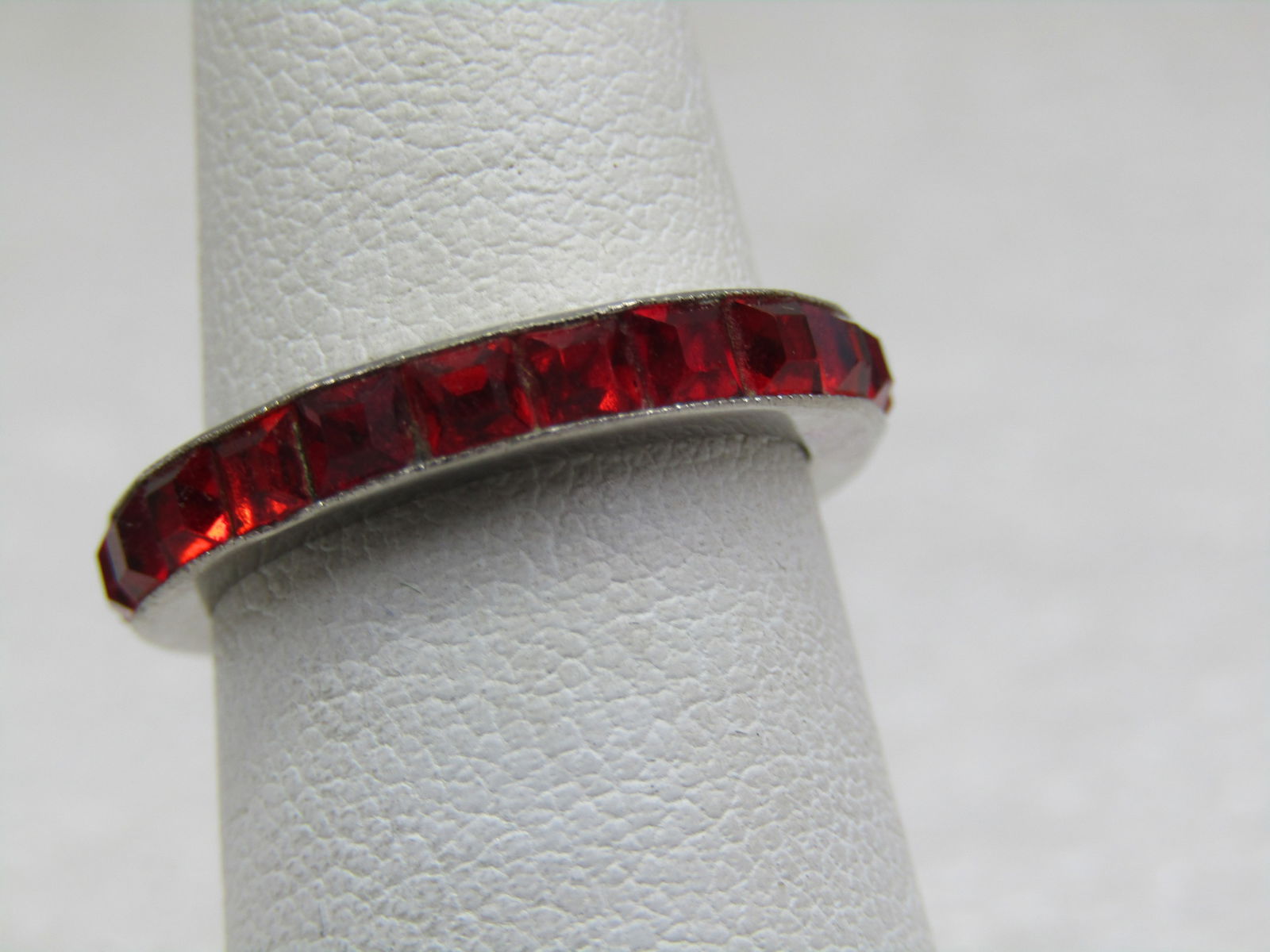 Vintage Sterling Red Orange Rhinestone CZ Ring, Sz. 6.5: Vintage Sterling Red Orange Rhinestone CZ Ring, Sz. 6.5, Signed H & SO Sterling. Tested and tests as sterling at appx. 2.04 gr. The stones are square channel set rhinestones or CZs that are appx. 3mm