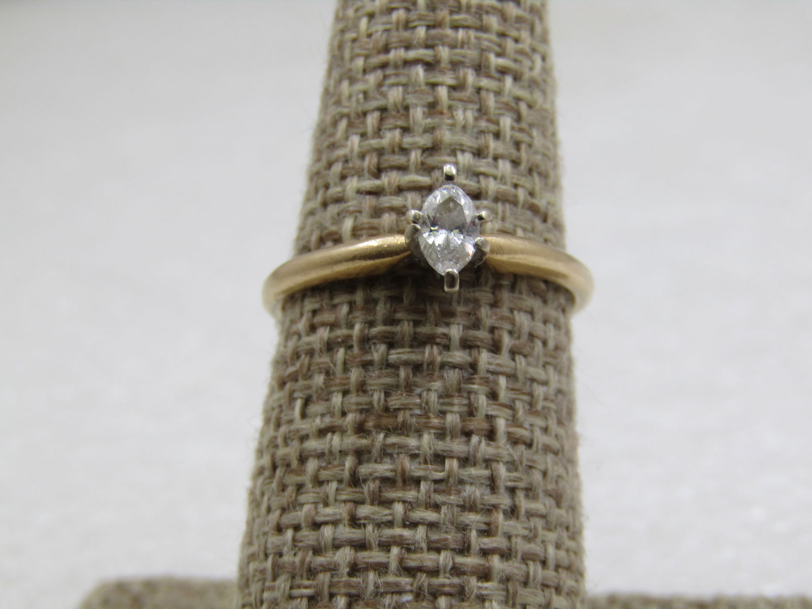 Vintage 14kt Marquise Diamond Engagement Ring, 25 ctw, Sz. 7, Signed: Vintage 14kt Marquise Diamond Engagement Ring, ,25 CTW, Sz. 7, Signed. Yellow gold band and white gold prongs. Weight of the ring is appx. 2.14 gr. Signed with an unknown maker's mark. Age is appx. 19