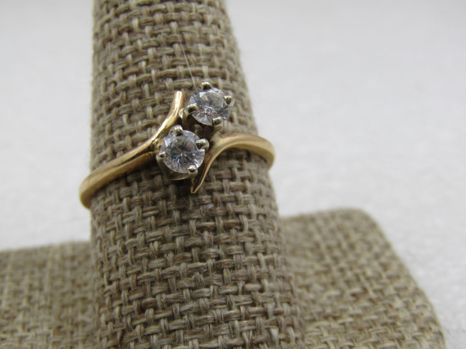 Vintage 10kt Double CZ Bypass Engagement Ring, Sz. 11.: Vintage 10kt Double CZ Bypass Engagement Ring, Sz. 11. 10kt white gold. Appx. .40 ctw between both stones. Age is appx. 1980's. Very good conditon . W10321.13X3 SS7210 J LD 5/11/22).intage 10kt