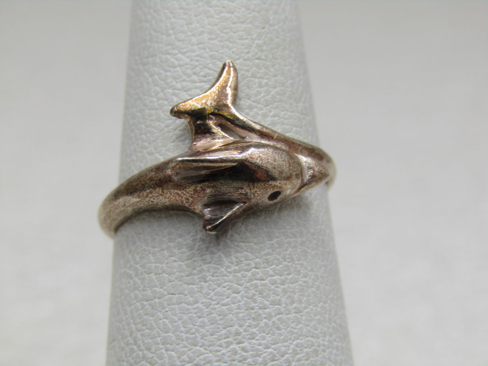 Sterling Silver Dolphin Bypass Ring, Sz. 6: Sterling Silver Dolphin Bypass Ring, Sz. 6 . Weight of the ring is appx. 1.79 gr. Dolphin with the tail that comes up from the other side of your finger and curves at the side of the dolphin's head. I