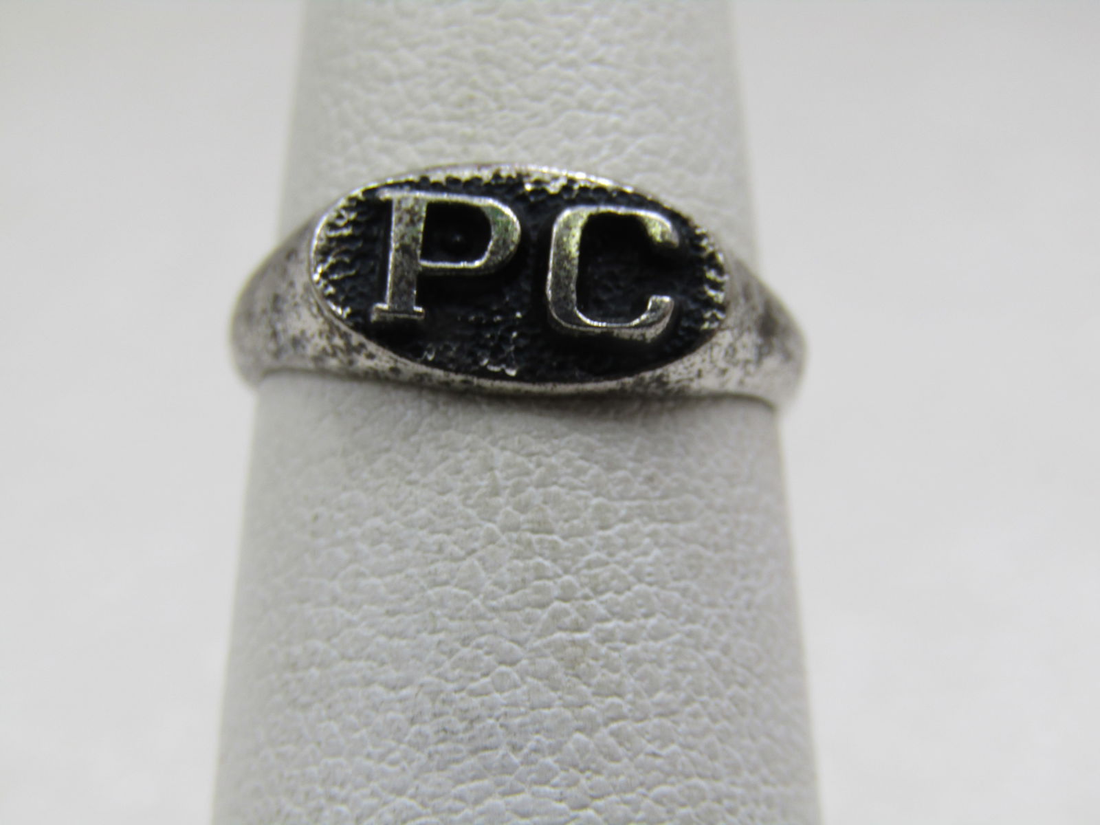 Vintage Sterling PC Initial Signet Ring, Sz. 5.25: Vintage Sterling PC Initial Signet Ring, Sz. 5.25, appx. 2.50 gr. Oval top that is appx. 11mm by 6.5mm with raised P C initials on top. the band is appx. 3.8mm at top shoulders and tapers to 2.5mm at