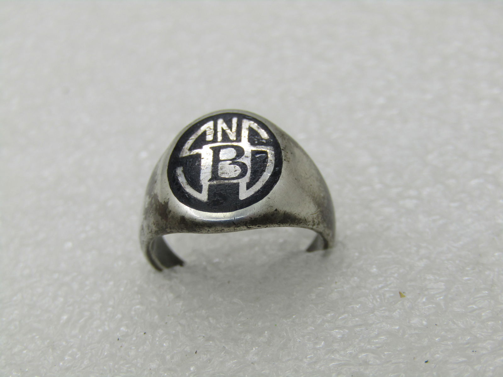 Vintage Sterling Initial/School Ring SNSB, Sz. 3, Signed ROCH NY: Vintage Stering Initial/School Ring SNSB, Sz. 3, Signed ROCH NY. Black stone or glass background with inlaid SNS initials and a B in the center. Not sure if this is a school or a signet type ring. The