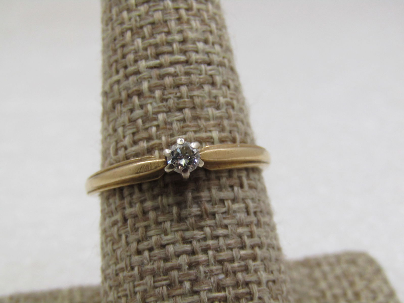 Vintage 14kt Diamond EngaGement/Promise ring, Sz. 9, .15 CT Mid-Century: Vintage 14kt Diamond Engaement/Promise ring, Sz. 9, .15 CT Mid-Century. A round cut diamond with six high prongs, one prong is broken on the top. The stone is stable and not moving. The prongs are