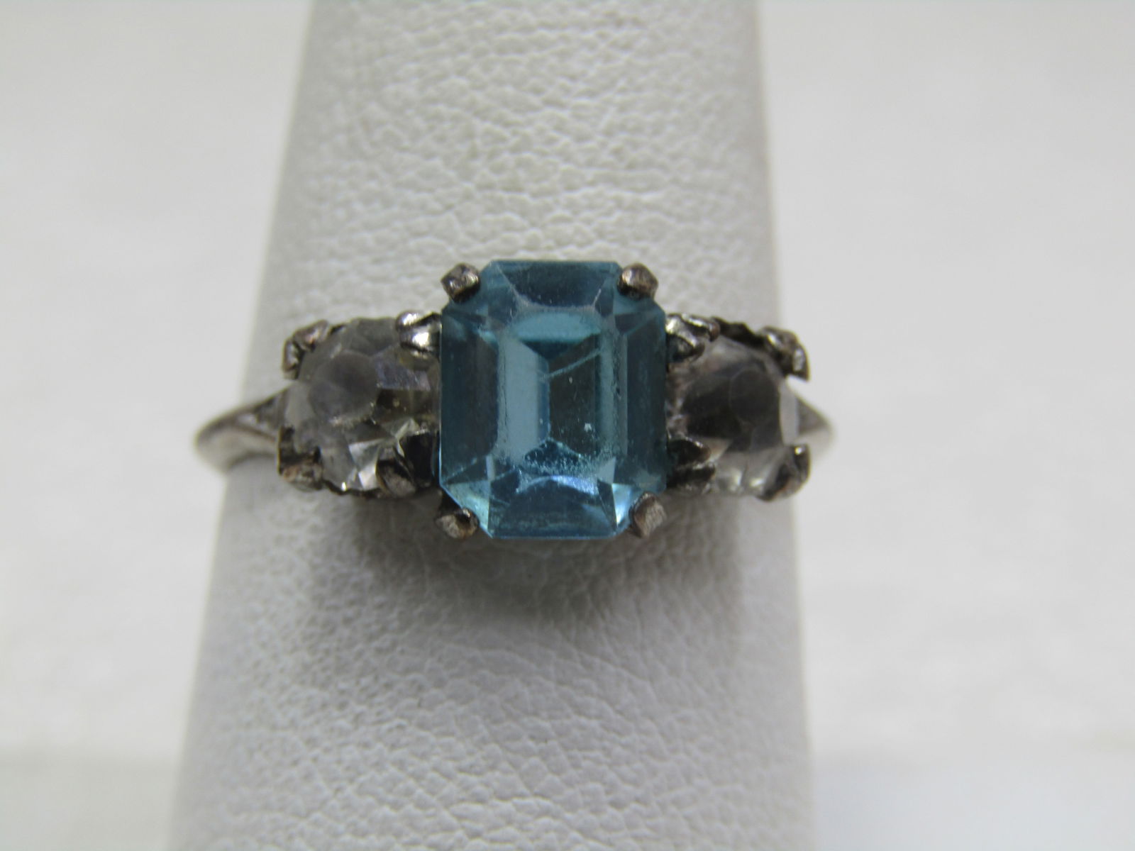 Vintage Sterling Aqua & Clear Rhinestone Ring, Sz. 8, 1940's, Signed: Vintage Sterling Aqua & Clear Rhinestone Ring, Sz. 8, 1940's, Signed with M and arrows. The center stone is a princess cut style aqua glass rhinestone that is appx.8mm by 6mm with a round clear 5mm rh
