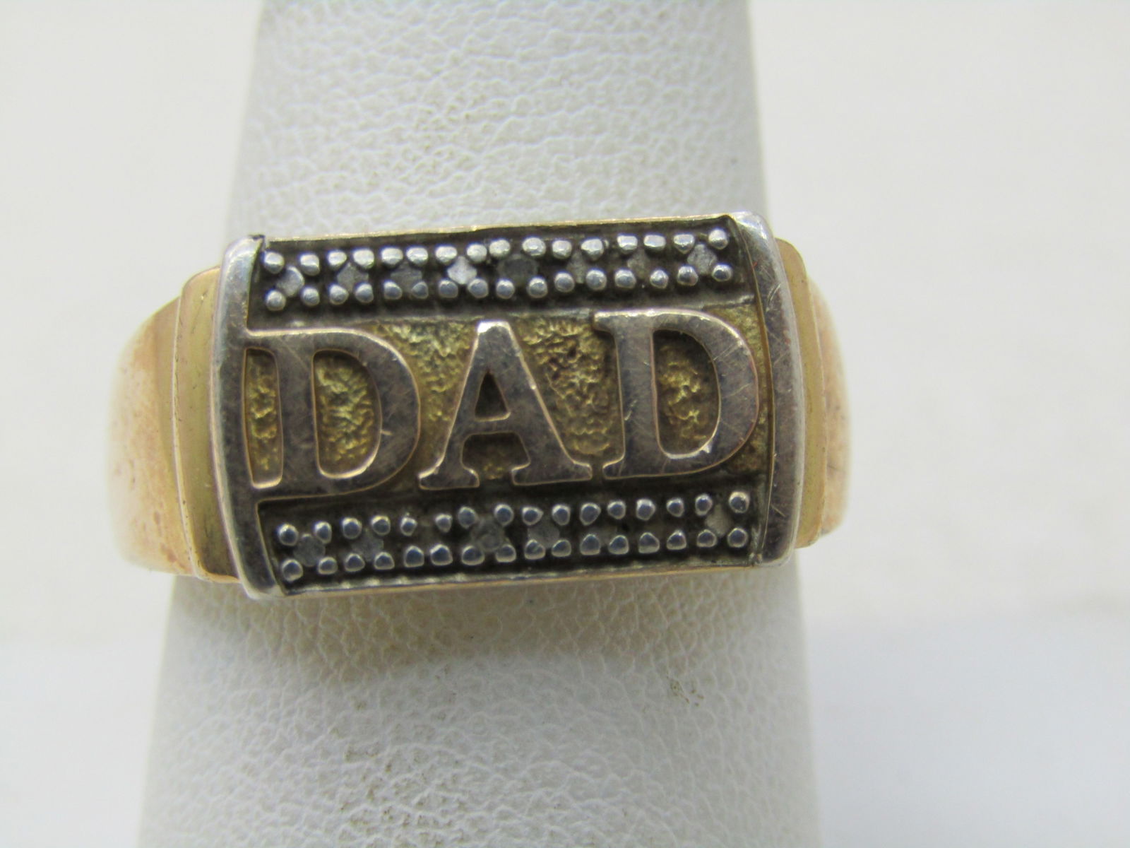 Vintage Sterling 10Kt. Plated DAD Ring, Size 10.5, 6.65 Gr., Signed DL: Vintage Sterling 10Kt. Plated DAD Ring, Size 10.5, 6.65 Gr., Signed DL, Illusion setting in silver over DAD and beneath - prong-like design with flat surfaces to create the look of diamond chips but