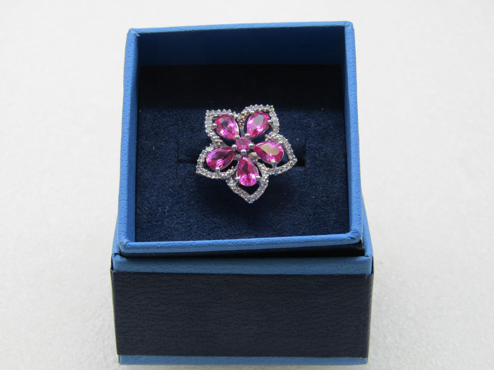 Sterling Silver Lab Pink Ruby Floral Ring, Clear CZ, Sz. 10.5: Sterling Silver Lab Pink Ruby Floral Ring, Clear CZ, Sz. 10.5, appx. 4.94 gr. The ring has 5 pear shaped pink stones that test as ruby, lab grown. The stones are apx. 6mm long with the rounded end on