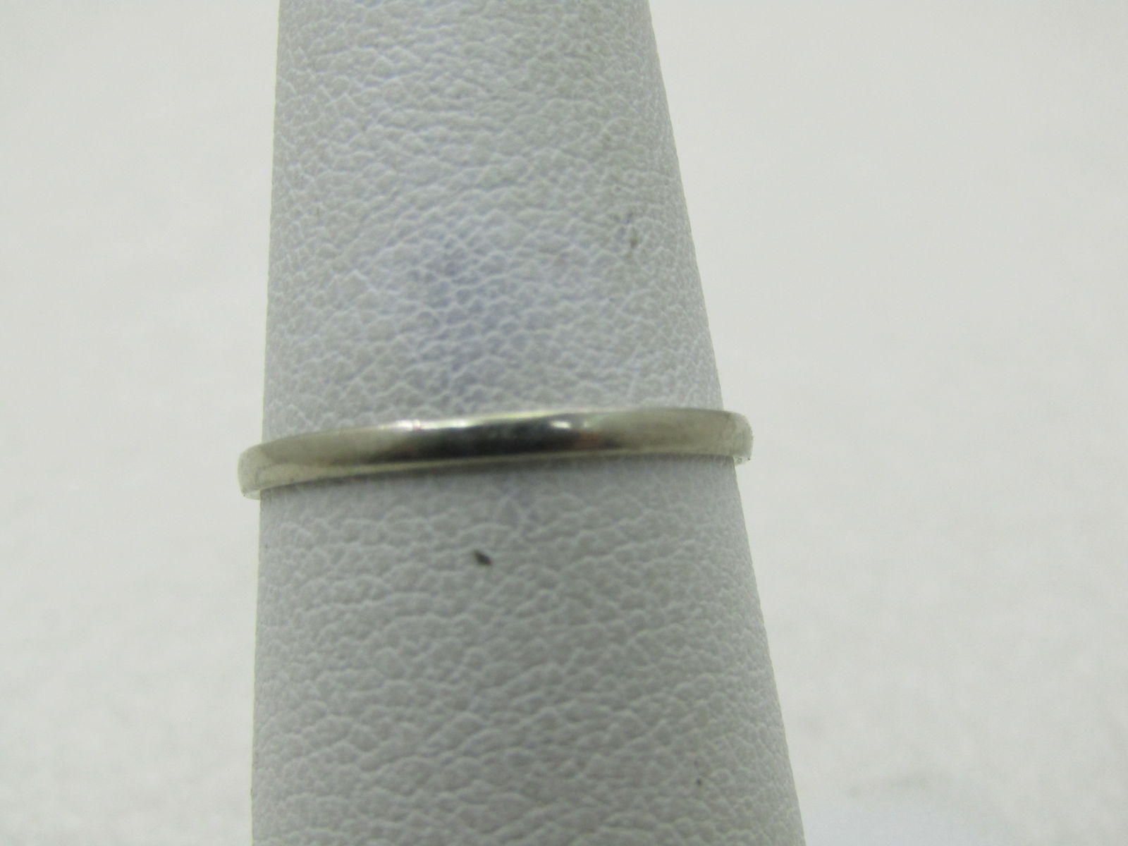 Vintage 18kt Werner Wedding Band, Sz. 6.5, 1.4mm: Vintage 18kt Werner Wedding Band, Sz. 6.5, 1.4mm. Thin band , white gold marked 18kt and tested. Weight is appx. .80 grams. Also clear signed Werner. The band is thin but not worn, it is even around