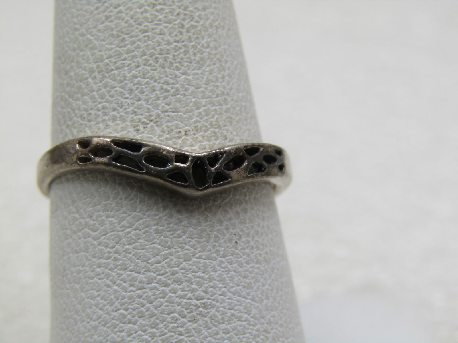 Vintage Sterling Pointed Ring with Cutouts, Signed, 1960's-1970's: Vintage Sterling Pointed Ring with Cutouts, Signed, 1960's-1970's. The ring is signed with a $ and marked .925 and tested with a weight of 1.47 gr. The ring is papx. 3mm wide at top and tapers to appx