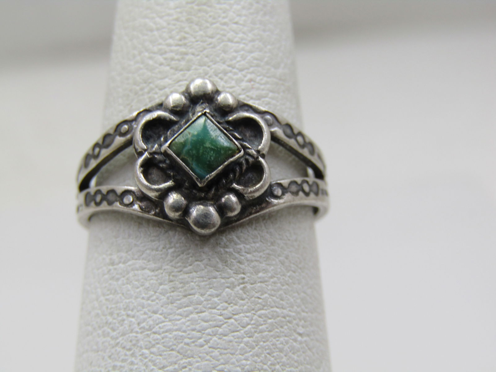 Vintage Sterling Southwestern Turquoise Ring, Sz. 6.5, Stamped: Vintage Sterling Southwestern Turquoise Ring, Sz. 6.5, Stamped. Scrolled and beaded top with a 4.5mm square turquoise stone on top that is bezel-set. The band is appx. 7mm split V-band on top and tape