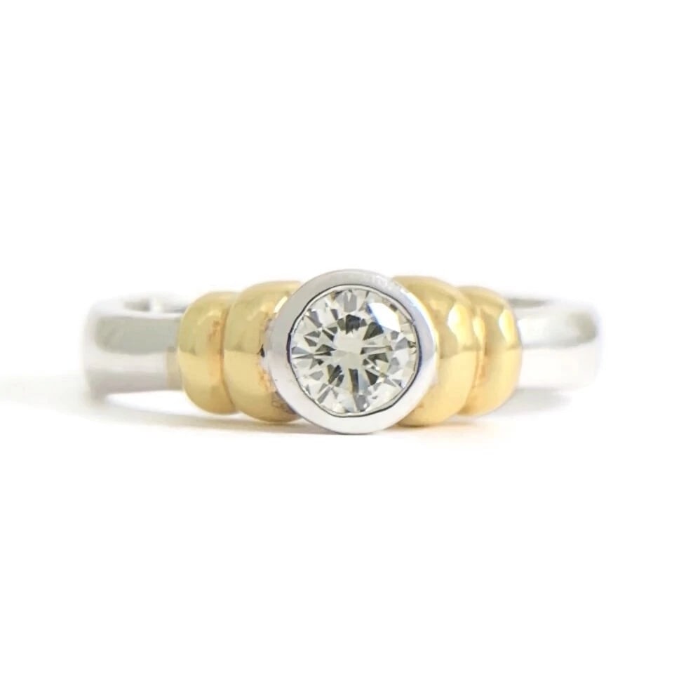 Two-Tone Round Bezel Diamond Ring 18K White Yellow Gold .32 CT: Title: Two-Tone Round Bezel Diamond Ring 18K White Yellow Gold .32 CT Description: Two-Tone Round Bezel Diamond Ring 18K White Yellow Gold .32 CT This lovely diamond ring is sure to make her smile! Do