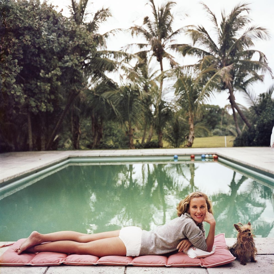 Slim Aarons Official Estate Print - Having A Topping Time - Oversize: 1959 (Printed later): Title: Slim Aarons Official Estate Print - Having A Topping Time - Oversize: 1959 (Printed later) Description: Having A Topping Time Socialite Alice Topping relaxing at a poolside in Palm Beach, 1959.