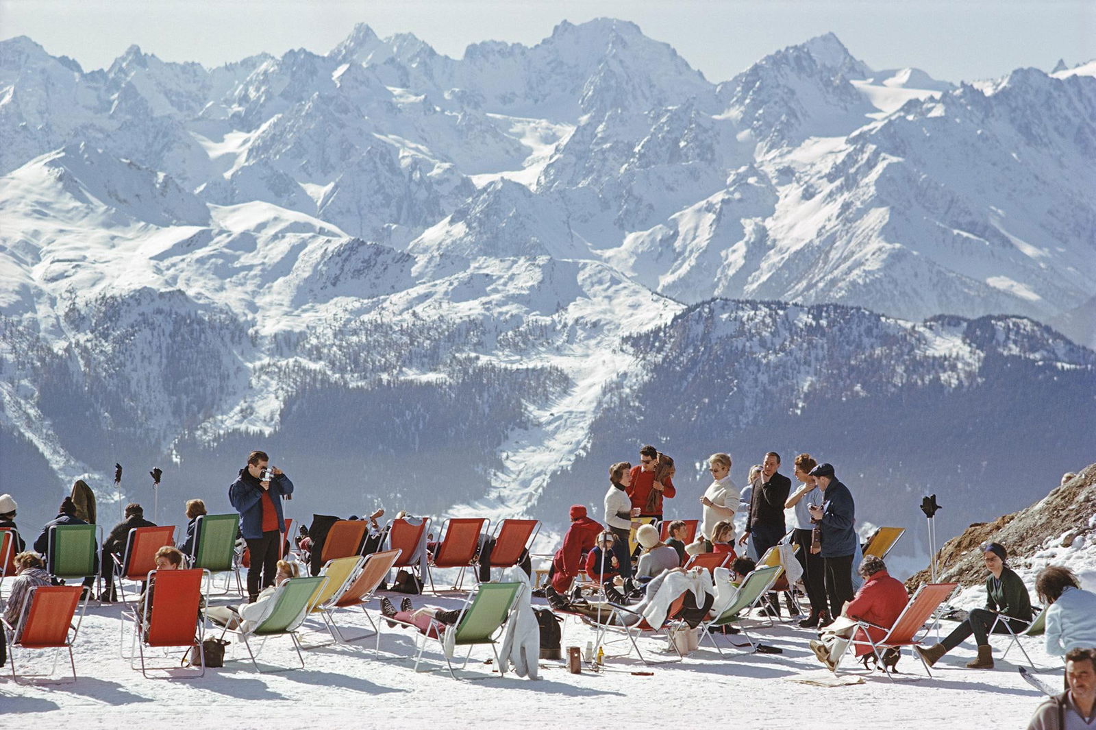 Slim Aarons - Lounging In Verbier Limited Estate Edition: 1964 (printed later): Title: Slim Aarons - Lounging In Verbier Limited Estate Edition: 1964 (printed later) Description: Lounging In Verbier' by Slim Aarons Holidaymakers in sun loungers on the slopes at Verbier,