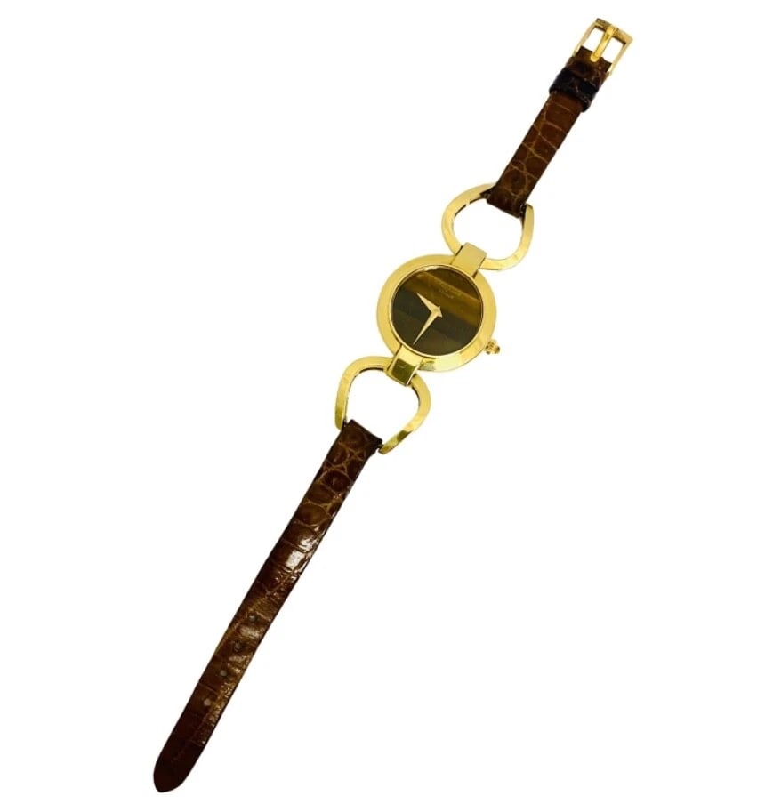 Chopard Watch Gold Tiger’s Eye Vintage 18k Gold: Title: Chopard Watch Gold Tiger’s Eye Vintage 18k Gold Description: Product details: DESNER: Chopard CRCA: Late 20th Century MATERALS: 18 karat Yellow old & Leather EMSTONE: Tiger’s Eye WE