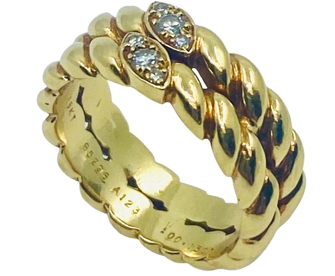 Van Cleef & Arpels Gold Braided Diamond Ring: Title: Van Cleef & Arpels Gold Braided Diamond Ring Description: Product details: DESNER: Van Cleef & Arpels CRCA: 1990’s MATERALS: 18k Yellow old EMSTONE: Round Brilliant Cut Diamond WEHT: 9.3