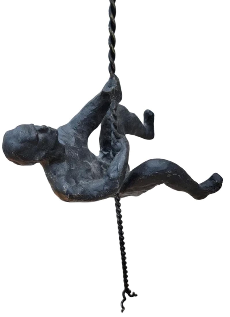 Climbing Man Wall Decor: Title: Climbing Man Wall Decor Description: Climbing Man Wall Decor Chic-meets-industrial in this thought-provoking take on wall décor. The climbing man is a reminder of everyday triumphs and rep