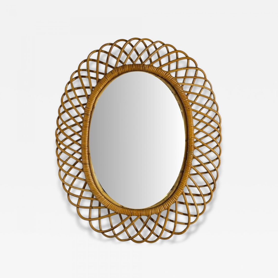 Italian Modern, Rattan, Bamboo, Wall Mirror, Italy, 1960s: Title: Italian Modern, Rattan, Bamboo, Wall Mirror, Italy, 1960s Description: Franco Albini Style, Italian Mid-Century Modern, Rattan, Bamboo, Wall Mirror, Italy, 1960s A scalloped rattan oval wall mi