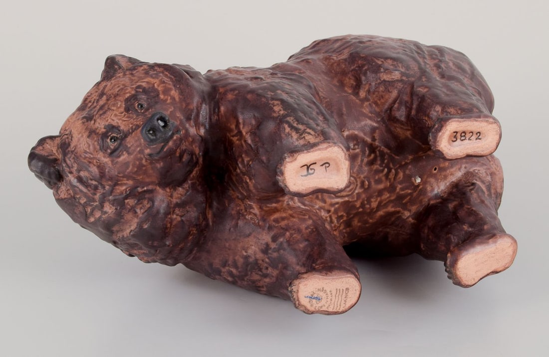 Jeanne Grut for Royal Copenhagen Aluminia faience. Large figurine of a brown bear. Dated 1945 - 5