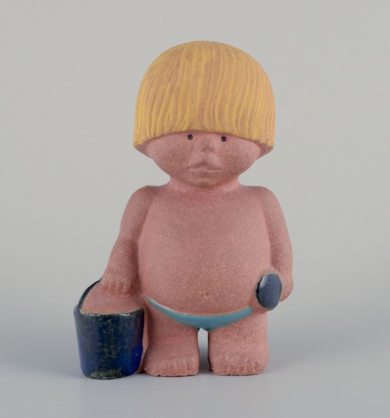 Lisa Larson for Gustavsberg. Stoneware figurine from the "Children of the World" series. Boy with a (1 of 8)