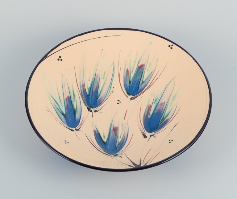 Heidi Fournier for Kähler, Denmark. Large ceramic bowl. Floral motifs on a cream-colored base. (1 of 6)