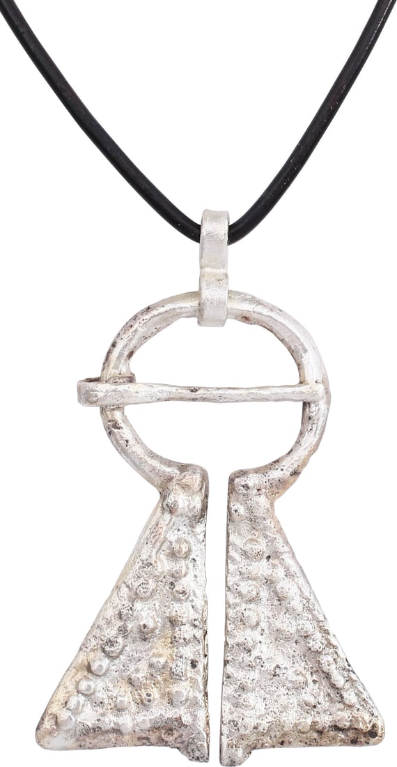 FINE VIKING PROTECTIVE BROOCH, C. 950-1050 AD: Large example, over 2" height of omega form. Circular top with large triangular terminals decorated in pelleted bands and clusters, possibly with celestial significance. The junctions with triple