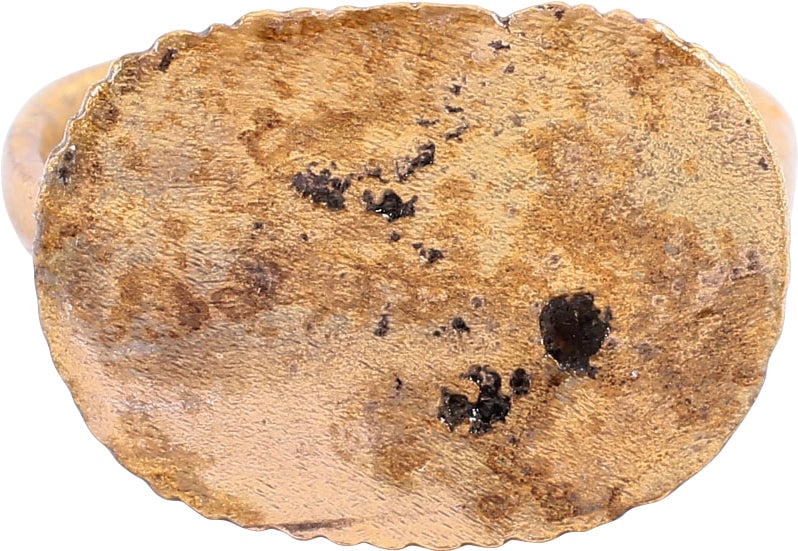 LATE ROMAN/MEDIEVAL RING, SIZE 8 ¼+: 7th-11th Century AD. Gilt bronze, size 8 ¼+ with oval-shaped bezel with the random incised pattern, perhaps astrological. Either decorative or to serve as a signet. Rounded face band 2.1mm at