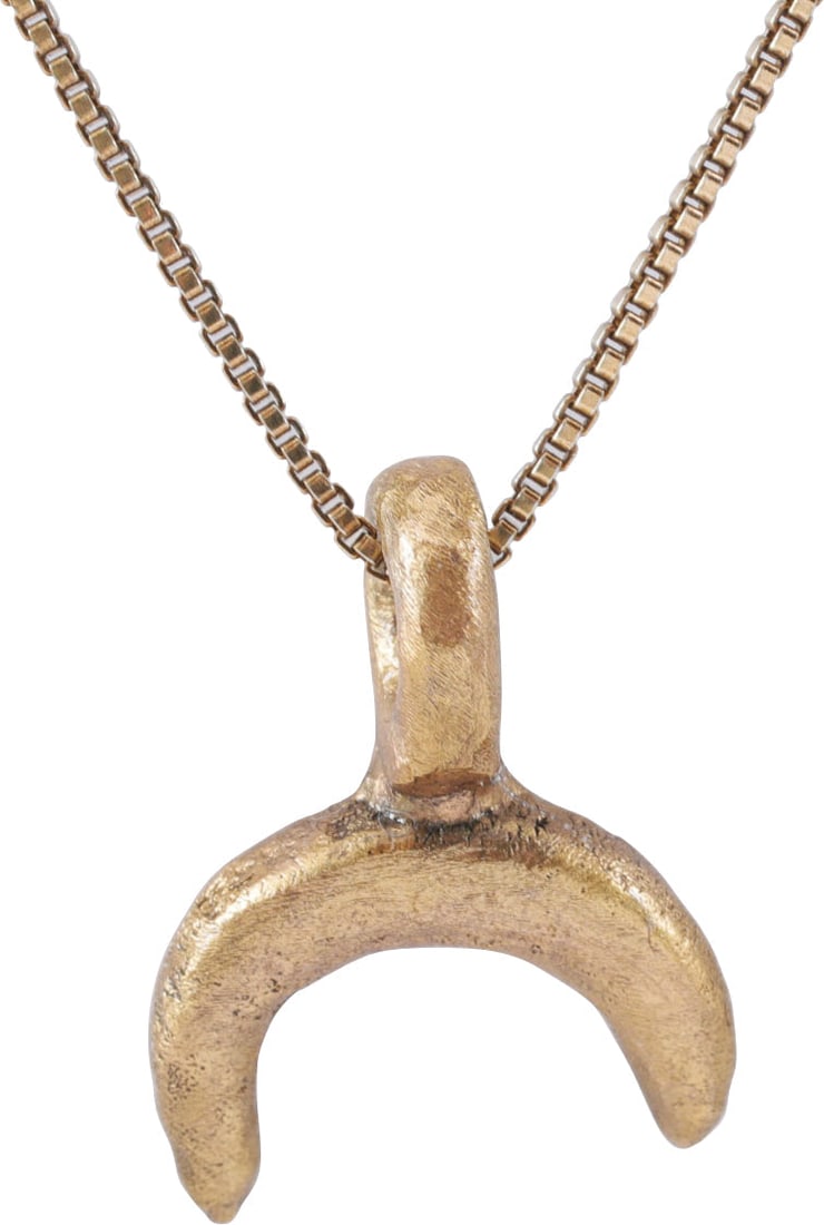 VIKING LUNAR PENDANT NECKLACE, 10TH-11TH CENTURY: Small example, just under 3/4” (0.68”)total height, of thick proportions. As expert navigators, the constellations signified mystery and power to Vikings. The Moon was personified as Mani,