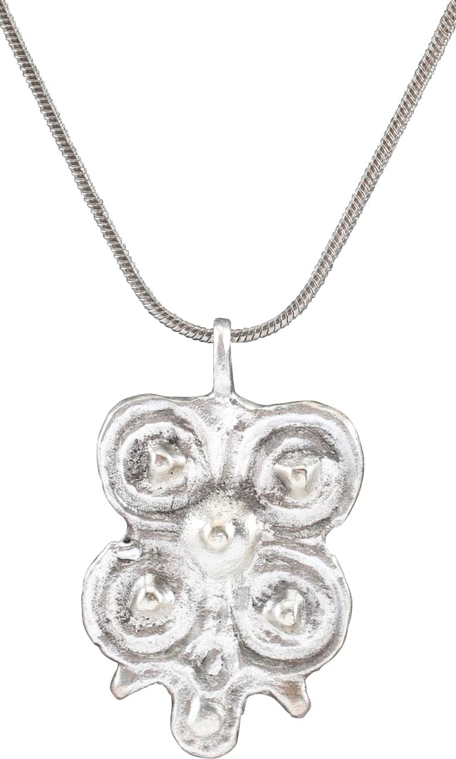 ITALIAN WOMAN'S PENDANT, C.1450-1650: Silvered bronze, just over 1 ¼" (1.26" ) total height, formed as four hemispheres surrounding a fifth. This form is thought to derive from the Medici family coat of arms which bears five circles.